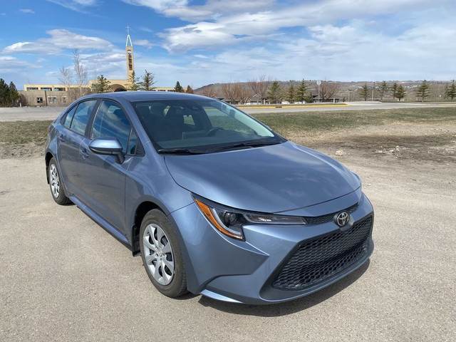 2021 Toyota Corolla LE - 2 SETS OF TIRES ON RIMS in Cars & Trucks in Calgary