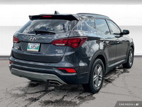 The 2017 Hyundai Santa Fe Platinum in Graphite offers all-wheel drive with a panoramic sunroof, heat... (image 5)
