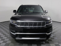 Driving our luxurious 2022 Jeep Grand Wagoneer Series I 4X4 in Diamond Black Crystal Pearl is a grea... (image 1)