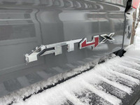 The 2025 GMC Sierra 1500 AT4X in Thunderstorm Grey Metallic is a formidable off-road truck that seam... (image 5)
