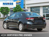 This 2022 Toyota Corolla LE boasts a sleek Black Sand Pearl exterior and is ready to elevate your da... (image 2)