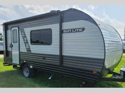 Sunset Park RV Sun Lite LTD 13BD highlights: 54in.in. x 74in.in. Full-Size Bed 9' Power Awning Two B...