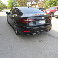 This 2019 Volkswagen Jetta is a stylish sedan with a sleek black exterior and dual tone black and pe... (image 7)