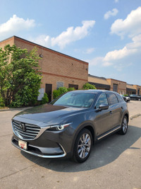 This 2022 Mazda CX-9 Grand Touring AWD is a sleek and spacious SUV that's perfect for your family ad... (image 1)