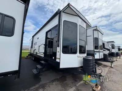 Forest River Wildwood Lodge destination trailer 40FDEN highlights: Two Slides King Bed with Versa-Ti...
