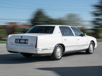 1997 Cadillac Deville White Exterior on blue Interior comes with Leather seats , Heated seats , Digi... (image 5)