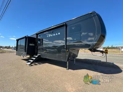 Keystone Cougar fifth wheel 316RLS highlights: Dual-Sink Vanity Kitchen Island Queen Bed Slide Tri-F...