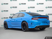 The 2023 Dodge Charger Scat Pack 392 in striking blue with a robust rear-wheel drive offers a dynami... (image 4)