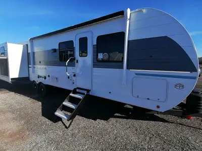 The 31KQBTS is the ultimate bunkhouse, with three total slide outs and an outside kitchen. This well...