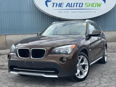 HEATED LEATHER SEATS | HEATED STEERING | NAV | PANO | ALLOY RIMS | BLUETOOTH | This 2012 BMW X1 XDRI...