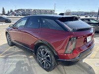 Finished in a head-turning Radiant Red Tricoat with a sleek Noir interior, the 2025 Cadillac Optiq E... (image 5)