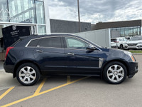 The 2015 Cadillac SRX Premium Collection, shown in Sapphire Blue Metallic, delivers confident perfor... (image 8)