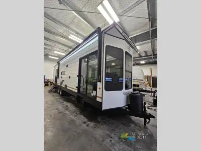 Forest River Wildwood Lodge destination trailer 353FLFB highlights: Two Lounge Chairs Front Bay Wind...