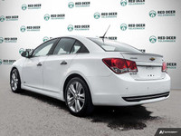 Get behind the wheel of the 2014 Chevrolet Cruze LTZ, a stylish white front-wheel-drive sedan known... (image 4)