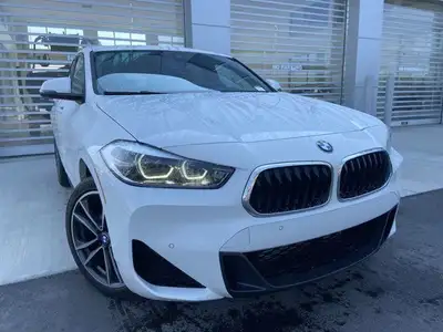 Unveil the allure of the 2022 BMW X2 xDrive28i, a summit of automotive craftsmanship adorned in a st...