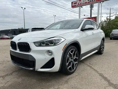 Make a bold statement with this eye-catching 2018 BMW X2, finished in sleek Alpine White over an ult...