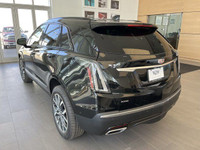 The 2024 Cadillac XT5 Sport featured in stellar black metallic with a maple sugar interior. A fusion... (image 5)