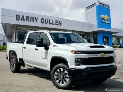 The 2025 Chevrolet Silverado 2500HD Custom in pristine white with a robust 44 drivetrain is designed...