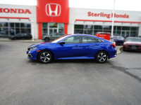 This Aegean Blue Metallic 2021 Honda Civic LX Sedan boasts a sleek profile and impressive fuel effic... (image 7)