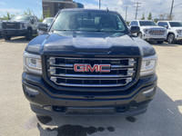Poised for performance and utility, the 2018 GMC Sierra 1500 SLT stands proudly with a sleek Onyx Bl... (image 2)