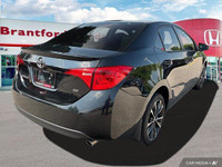 This 2017 Toyota Corolla SE boasts a sleek Slate Metallic exterior and a comfortable BLACK SOFTEX LE... (image 5)