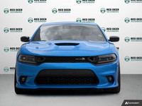 The 2023 Dodge Charger Scat Pack 392 in striking blue with a robust rear-wheel drive offers a dynami... (image 2)