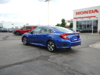 This Aegean Blue Metallic 2021 Honda Civic LX Sedan boasts a sleek profile and impressive fuel effic... (image 6)