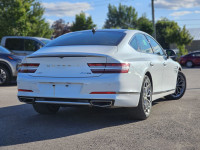 Experience the impressive 2023 Genesis G80 2.5T Advanced, a stunning white all-wheel-drive sedan tha... (image 1)
