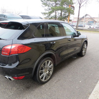 This 2011 Porsche Cayenne is a sleek and powerful SUV that's sure to turn heads. With its black exte... (image 4)
