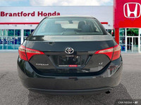 This 2019 Toyota Corolla LE boasts a sleek Black Sand Pearl exterior and a comfortable black interio... (image 4)