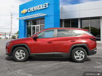Command attention with the 2023 Hyundai Tucson Preferred, a crimson red SUV that seamlessly blends s... (image 2)