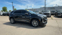 This Cadillac XT5 is equipped with: Leather Seating Surfaces w/Mini Perforated Inserts, Power moonro... (image 6)