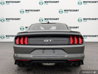 This Carbonized Grey Metallic 2022 Ford Mustang GT is an iconic sports car that delivers exhilaratin... (image 4)