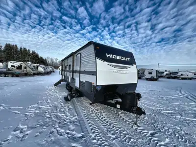 Keystone Hideout DLX travel trailer 25RDSWE highlights: Exterior Pass-Through Front Master Bedroom U...