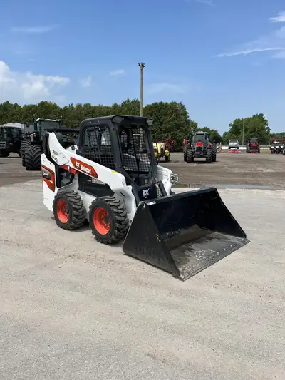 2023 Bobcat S64, w/ 72in. bucket, 1150hrs, open station, hand and foot controls, single speed, stand...
