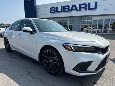 Do not miss out on this low mileage, locally owned and traded 2023 Sport Touring Civic in a RARE Man...