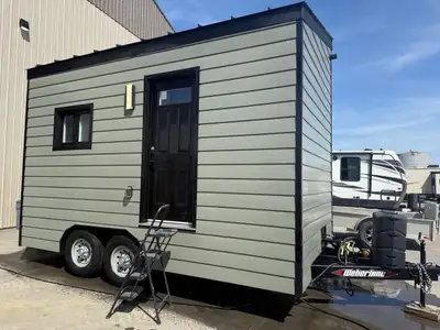 The 2023 Vanguard model by Small Living Company is an impeccably crafted 8 x 16-foot tiny home, blen...