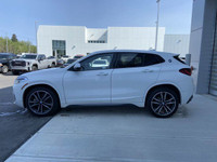 Unveil the allure of the 2022 BMW X2 xDrive28i, a summit of automotive craftsmanship adorned in a st... (image 4)