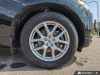 The 2021 Volvo XC60 T5 AWD Momentum is a sophisticated black SUV that offers an impeccable balance o... (image 6)