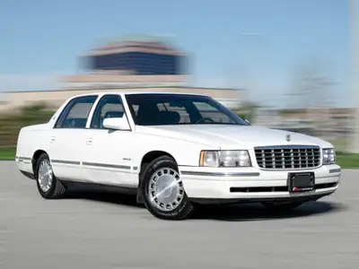 1997 Cadillac Deville White Exterior on blue Interior comes with Leather seats , Heated seats , Digi...