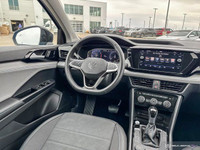 The 2024 Volkswagen Taos Comfortline Black Edition AWD blends turbocharged performance with bold bla... (image 9)