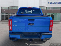 This 2021 Ford Ranger 4x4 Crew Cab, Velocity Blue with a sleek black interior, is ready for adventur... (image 3)
