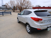 Drive with confidence in this 2011 Hyundai Tucson! With its spacious interior, smooth handling, and... (image 6)