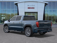 The 2025 GMC Sierra 1500 Denali Ultimate, finished in Downpour Metallic with a refined Alpine Umber... (image 5)