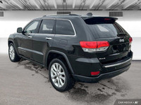 This Grand Cherokee features leather-trimmed, ventilated front seats, heated front and rear seats, p... (image 3)