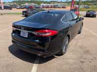 WAS: $16995 NOW: $15995Stylish and efficient, thi s2018 Ford Fusion SE offers a smooth ride with its... (image 6)