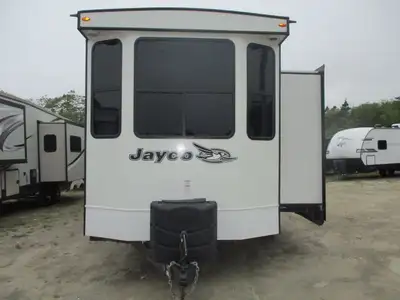 A 3 slide , 2 door ,2 bedroom park model with a front kitchen , rear queen bedroom , side bunkroom w...