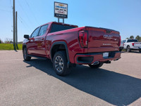 Experience rugged capability and premium refinement in this 2024 GMC Sierra 1500 AT4 4WD Crew Cab, t... (image 2)
