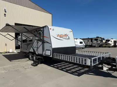 The 2015 KZ MXT 210 is a lightweight toy hauler travel trailer built for versatility and function. T...
