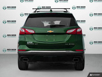 The 2018 Chevrolet Equinox Premier AWD in a striking green finish offers a dependable and confident... (image 5)